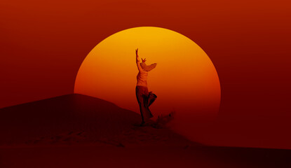 Muslim woman in gray trousers and a scarf jumps on the sands of the Sahara desert at sunset - Sahara, Morocco 