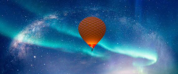 Hot air balloon flying over aurora borealis with our galaxy is Milky way spiral galaxy 