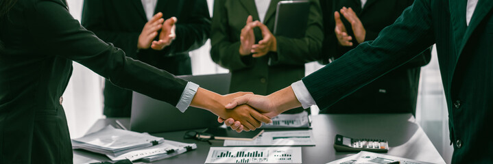 Analyst team handshake after successful planning business marketing with handshake. Panorama shot...