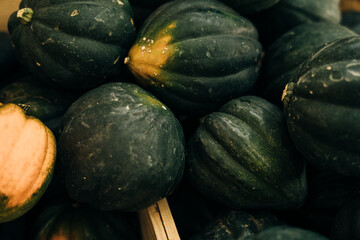 Decorative yellow pumpkins on display at the farmers market