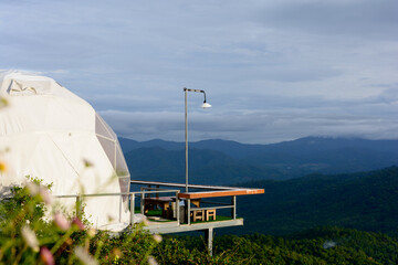 Geodesic dome tent for camping and beautiful landscape on hill in rainy season at Mon Jam, Chiang...