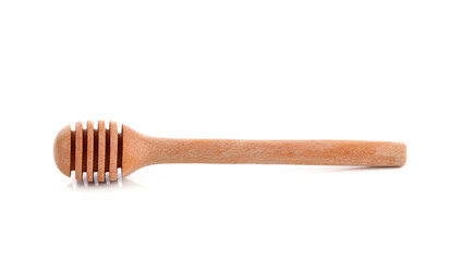 Close up view of a honey dipper isolated on a white background