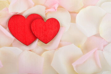 Red heart on pink rose flowers petals background