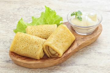 Stuffed pancakes with meat and cream