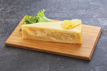 Parmesan cheese piece over board