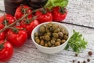 Marinated green capers in the bowl