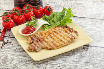 Grilled pork steak with ketchup