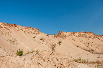 Fototapeta na wymiar sand pit against the blue sky