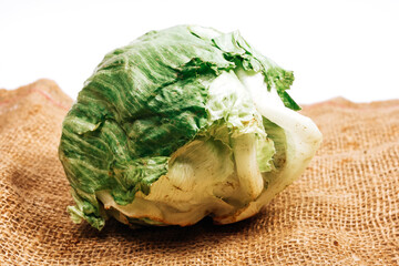 head of iceberg lettuce on burlap