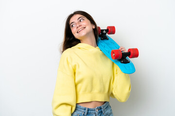 Young caucasian woman isolated on white background with a skate with happy expression