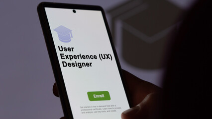 05th August 2023. A student holds a phone, enrolls in courses to study user experience (ux) designer program, learn new skill and pass certification. Text in English, English text.