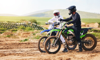 Obraz premium Sports, friends and men with motorcycle in countryside for fun, hobby and stunt training, practice or freedom. Off road on dirt, motorbike and biker people in nature for adrenaline, challenge or race