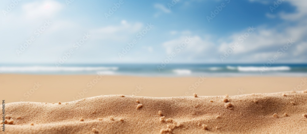 Poster close-up shot of sand with a blurred background of the sea and sky on a summer day. suitable for