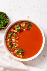 Spanish tomato gazpacho cold soup styled and decorated in white plate