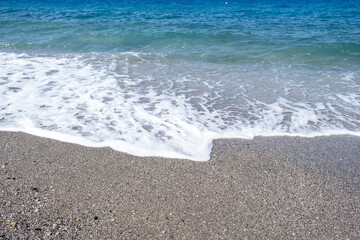Sea waves run on the shore of the sea or ocean. Beautiful relaxing view on vacation.