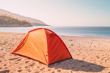Serenity awaits along the Lycian Way as a camping tent finds its place on a picturesque beach, promising an escape into coastal bliss.