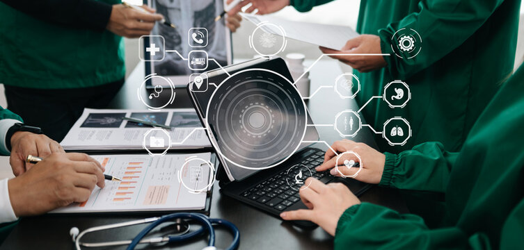 Medical technology network team meeting concept. Doctor hand working with smart phone modern digital tablet and laptop computer with graphics chart interface, with virtual icon diagram.