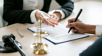 Business people negotiating and signing a contract.