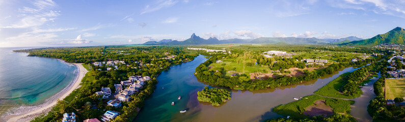 fishing boats resting at tamarin bay, Mauritius island, indian ocean, Africa with Tamarin mountain on the background