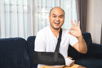 Social security and health insurance concept. Young Man suffer pain from accident fracture broken...