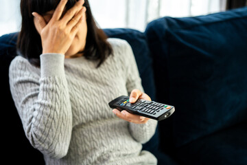 Young woman watching television with various action.Woman holding TV remote changing program menu enjoy watching.