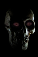 Naklejka premium Scary human skull with purple eyes