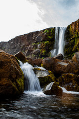 waterfall in the mountains on iceland