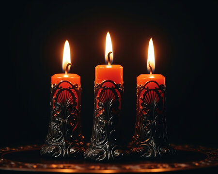 Three lit candles facing each other black background, diwali stock images, realistic stock photos