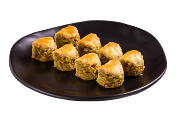 Pistachio baklava. Baklava filled with pistachio isolated on white background. Turkish cuisine desserts. close up