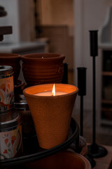 Candle burning in the dark room, moody image