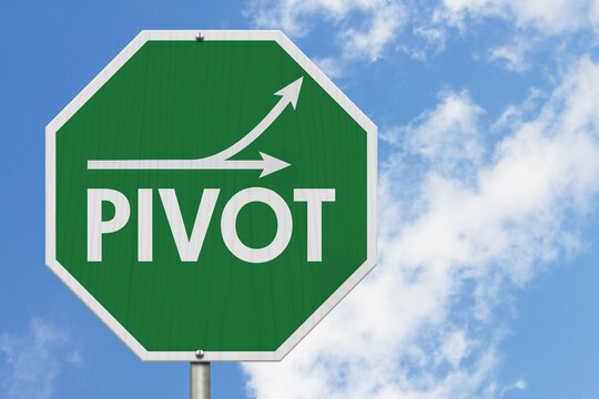 Green and white pivot sign