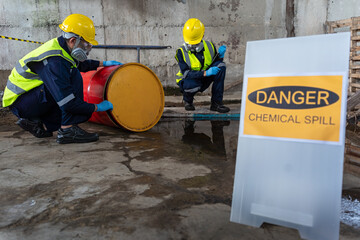 Two officers wearing gas masks inspected the area of a chemical leak in an industrial warehouse to...