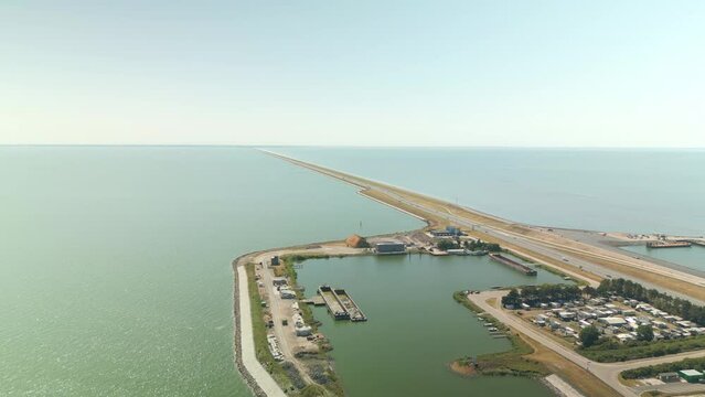 Flying overt the sea and the Afsluitdijk in holland on morning