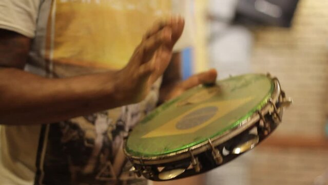 playing tambourine, percussion instrument