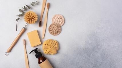 Set of eco friendly toiletries and kitchen products on gray background