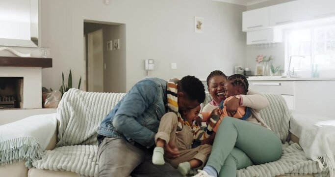 Mother, father and children on sofa playing for bonding, healthy relationship and relax in living room. Happy family, playful and African mom, dad and kids laughing on couch for fun, cuddle and love