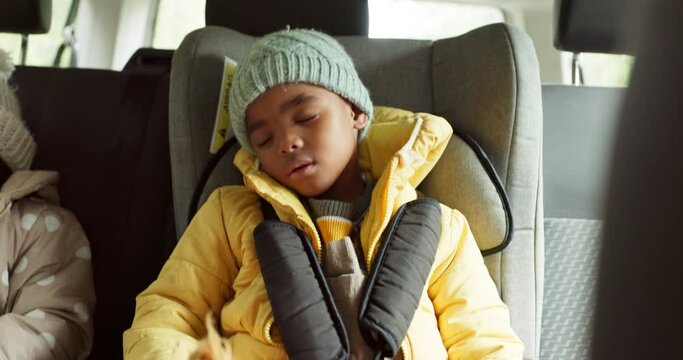 Car, travel and child sleep in backseat on road trip for holiday, vacation and weekend on drive. Safety, family and tired kids with seatbelt for transportation, driving and journey in motor vehicle