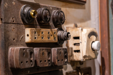 Close-up view of the vintage switch buttons and sockets.