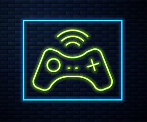 Glowing neon line Wireless gamepad icon isolated on brick wall background. Game controller. Vector © Kostiantyn