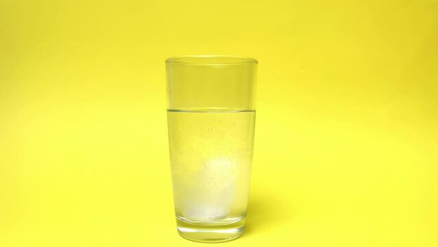 Effervescent tablet in a glass of water, soluble tablet for colds, treatment, weight loss.