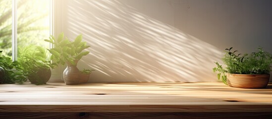 A background of a kitchen wooden countertop with sunlight beams and window and leaf shadows.