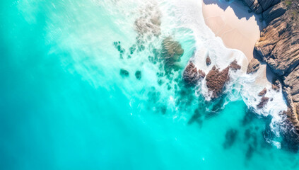 Beach and waves from top view. Turquoise water background from top view. Summer seascape from air....