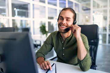 A man working as a call center operator in an office
