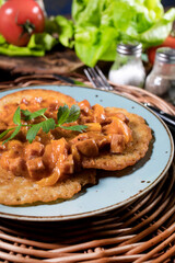 Homemade potato pancakes with goulash.