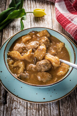 Meatballs in gravy with cast noodles.