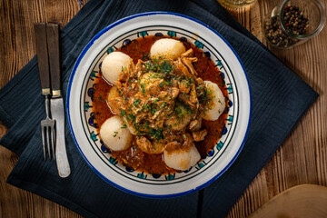 Dumplings with turkey and chorizo sauce.