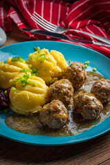 Meatballs with potatoes in dill sauce.