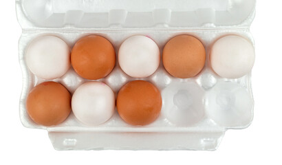 Open egg box with eight white and brown eggs isolated from background. Top view of fresh organic...