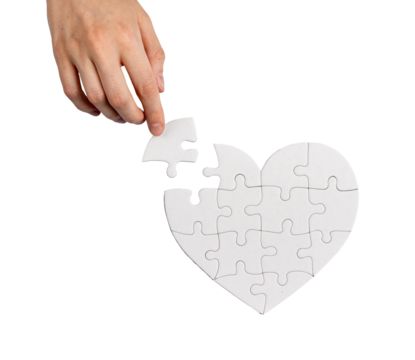 Completing heart shaped puzzle with missing lacking piece isolated on white background. Love problems solving concept