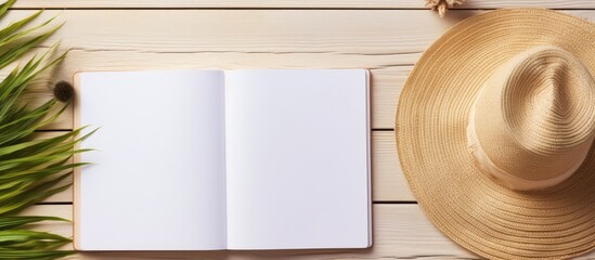 A blank writing book with summer beach accessories in the background, offering plenty of space